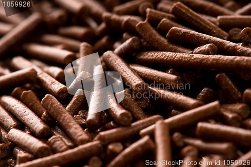 Image of chocolate sprinkles on white background