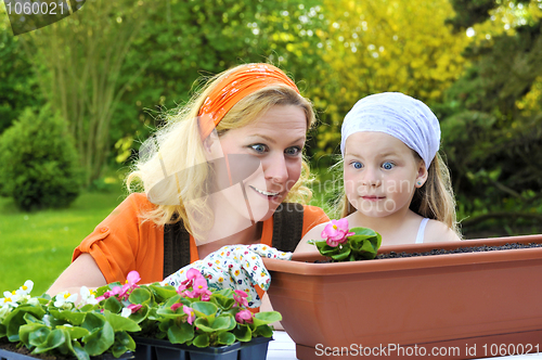 Image of Mother and daughter having gardening time