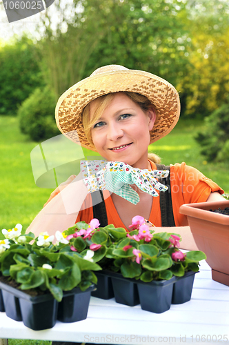 Image of Young woman - gardening