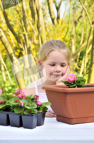 Image of Little girl - gardening