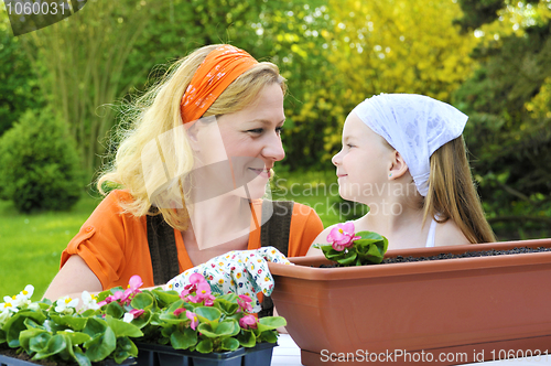 Image of Mother and daughter having gardening time
