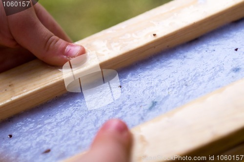 Image of child making hand made paper