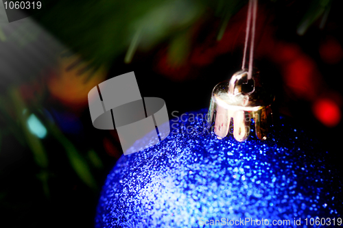 Image of Christmas ornaments on tree.