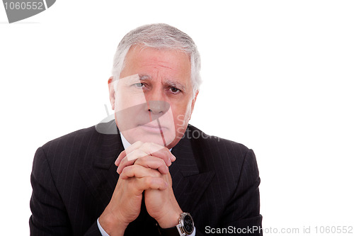 Image of Portrait of a handsome mature businessman, thinking with hands crossed