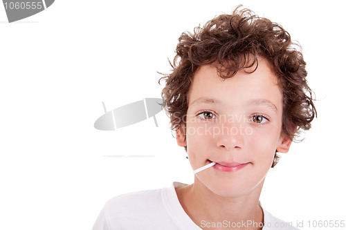 Image of Cute Boy with a candy on mouth smiling