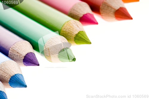 Image of Collection of colorful pens over white background