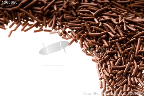 Image of chocolate sprinkles on white background