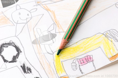 Image of pencil and child drawing