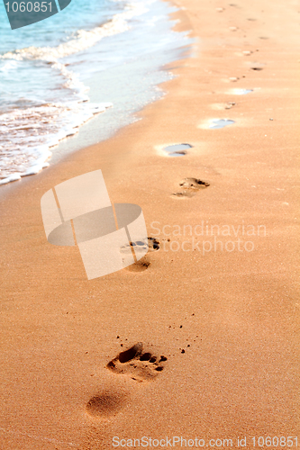 Image of footprints on sand beach