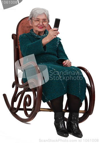 Image of Senior woman taking photos with a phone