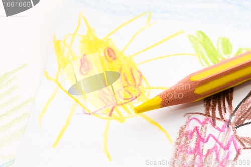 Image of pencil and child drawing