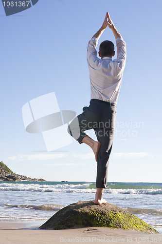 Image of Businessman doing equilibration exercise