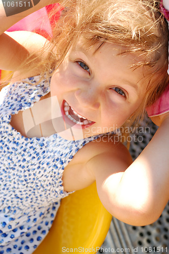 Image of happy smiling little girl outdoor