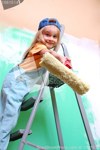 Image of child on ladder with a roller