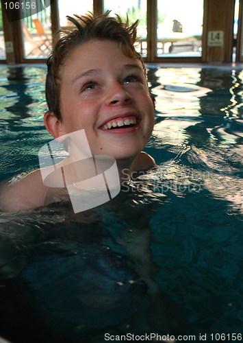 Image of BOY IN A SWIMMING POOL