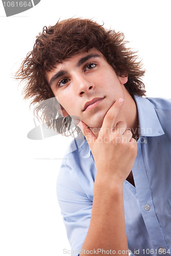 Image of young and handsome man, thinking