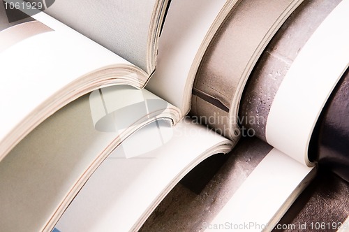 Image of Stack of open magazines