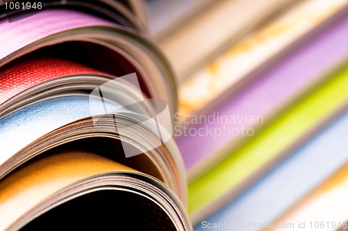 Image of Stack of open magazines