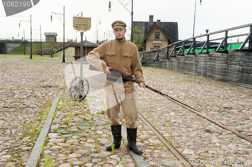 Image of Soldier with  gun in retro style picture