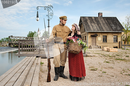 Image of Couple of lady and soldier in retro style picture