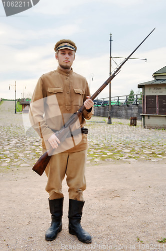 Image of Soldier with  gun in retro style picture