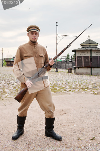 Image of Soldier with  gun in retro style picture