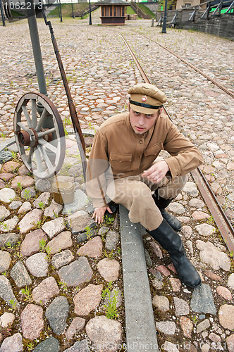 Image of Retro style picture with resting soldier.