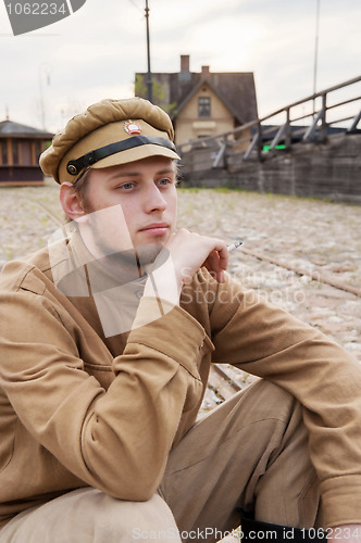 Image of Retro style picture with resting soldier.