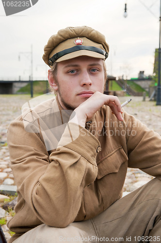 Image of Retro style picture with resting soldier.