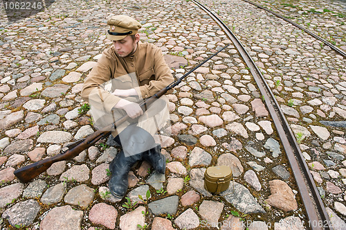 Image of Soldier with boiler and gun in retro style picture