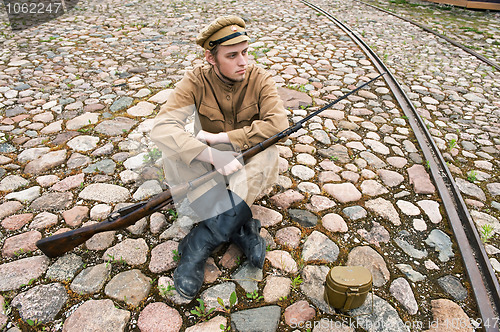 Image of Soldier with boiler and gun in retro style picture