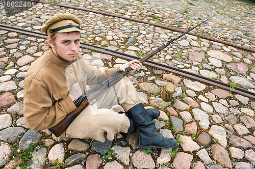 Image of Soldier with boiler and gun in retro style picture