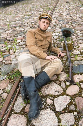 Image of Retro style picture with resting soldier.