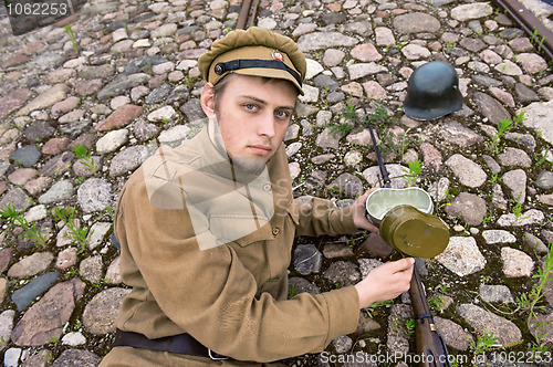 Image of Soldier with boiler and gun in retro style picture