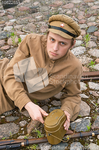 Image of Soldier with boiler and gun in retro style picture