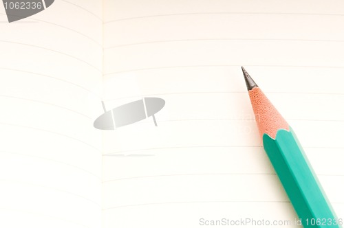 Image of pencil and blank notebook