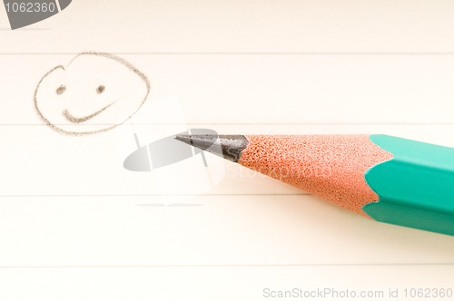 Image of pencil writing on white paper