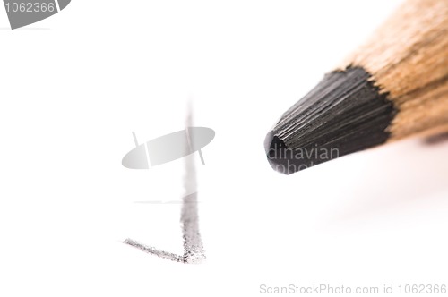 Image of pencil writing on white paper