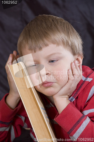 Image of child and book