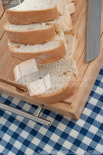 Image of Slices of bread on top of wooden board