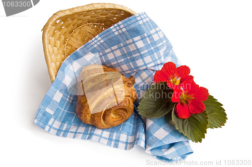 Image of Croissant with a basket and flowers