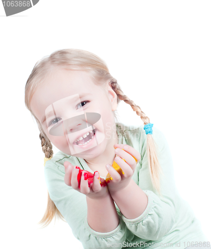 Image of Little girl playing with colors