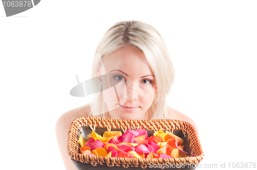 Image of Woman and petals on the plate