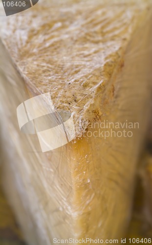 Image of Cheese wedge in clingfilm