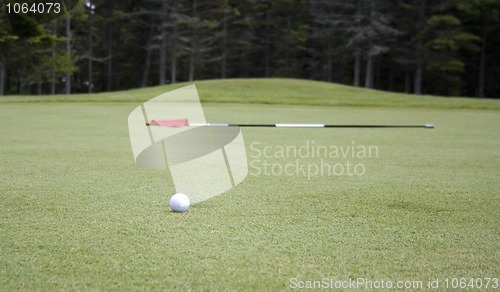 Image of Golf Flag and Ball