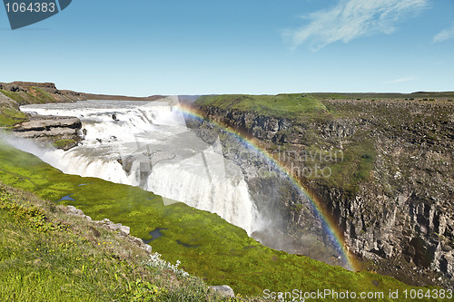 Image of Gullfoss waterfall under a beautiful rainbow