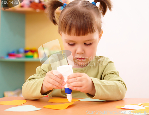 Image of Little girl doing arts and crafts in preschool