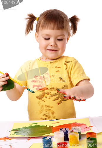 Image of Cute child paint her fingers