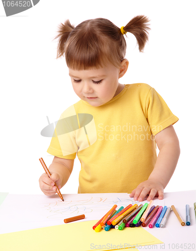 Image of Cute child draws with felt-tip pens