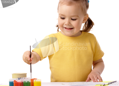 Image of Cute child play with paints